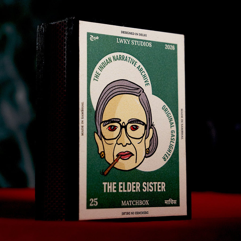 A  'The Elder Sister' matchbox , standing upright on a red surface against a dark, smoky background. The packaging features a green and white design with a stylized illustration of an elderly woman wearing glasses and smoking a cigar.
